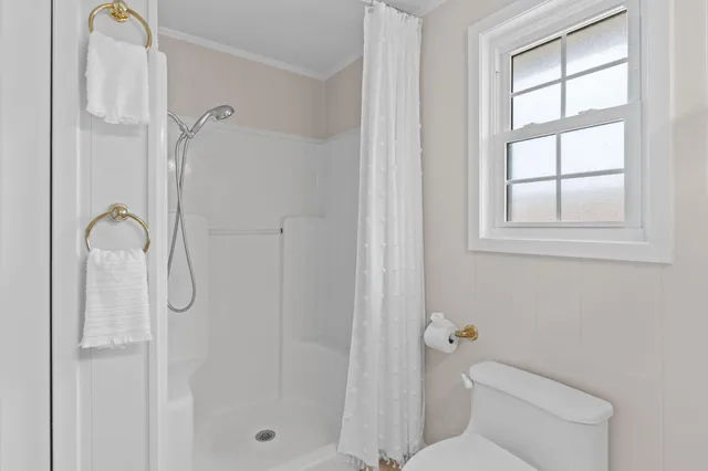 an aerial view of residential building and ocean