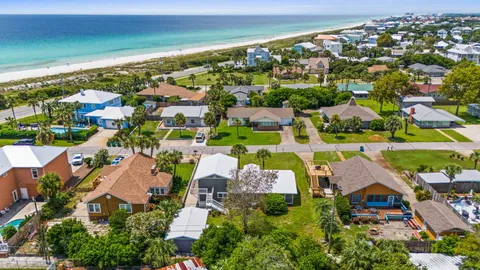 a living room with furniture potted plant and a window