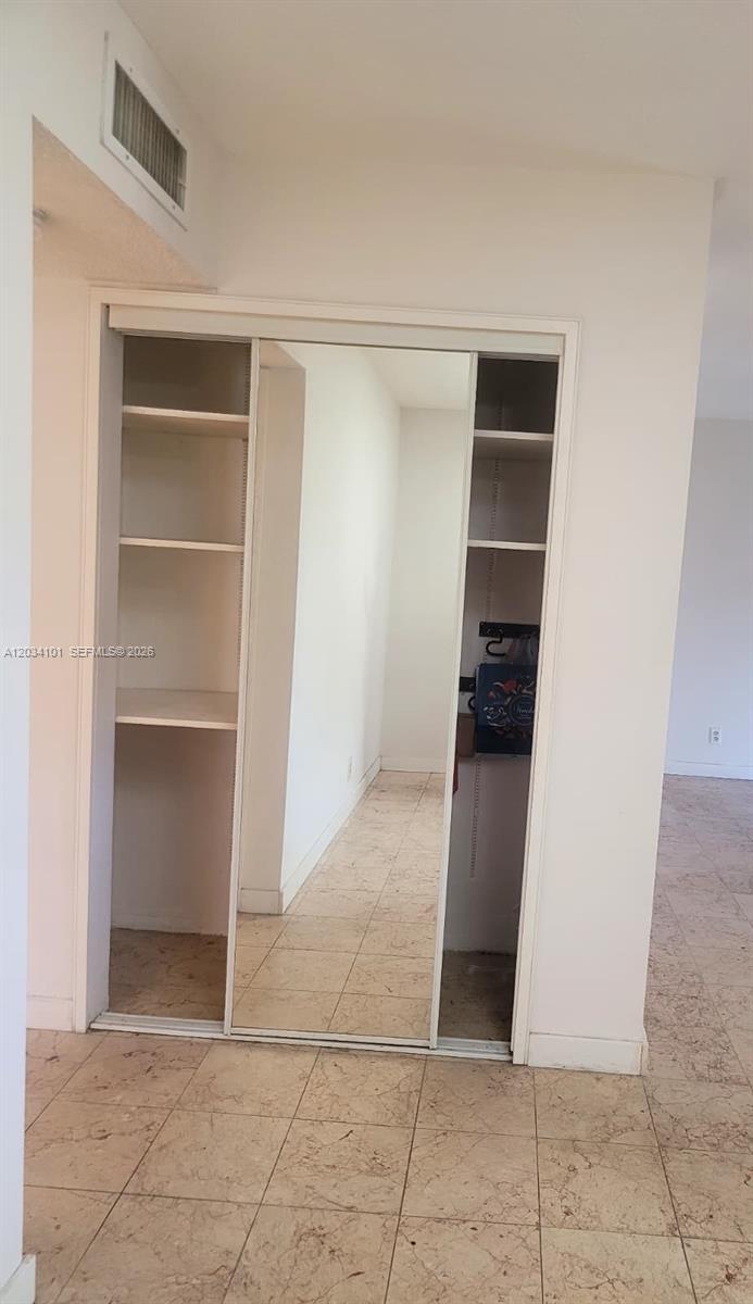 1231 Northwest 13th Street, Unit 464F Boca Raton, FL 33486 - Photo 9 of 21 Living Area Closet