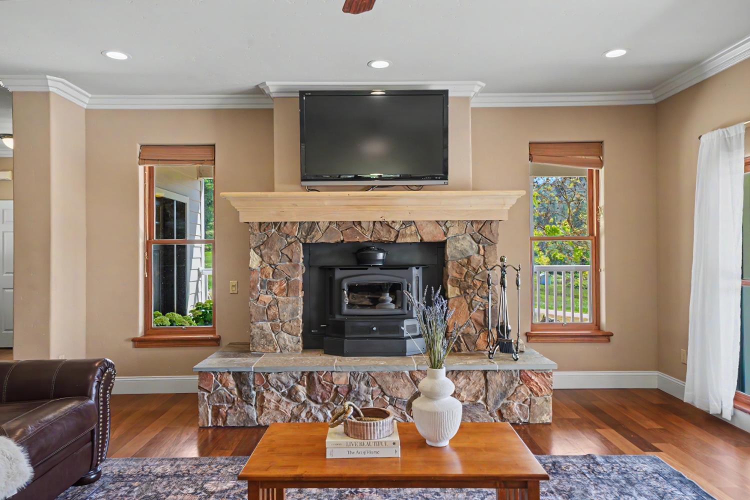 22930 Meadow View Road Fiddletown, CA 95629 - Photo 29 of 95 a living room with furniture and a fireplace