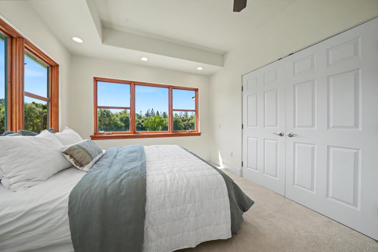 22930 Meadow View Road Fiddletown, CA 95629 - Photo 51 of 95 a bedroom with a large bed and a large window
