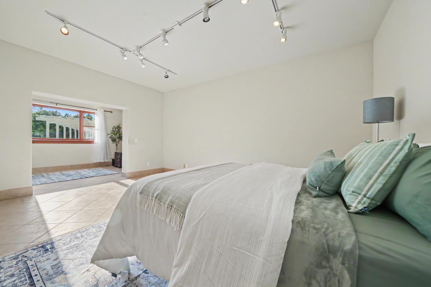 22930 Meadow View Road Fiddletown, CA 95629 - Photo 61 of 95 a bedroom with a bed and a window