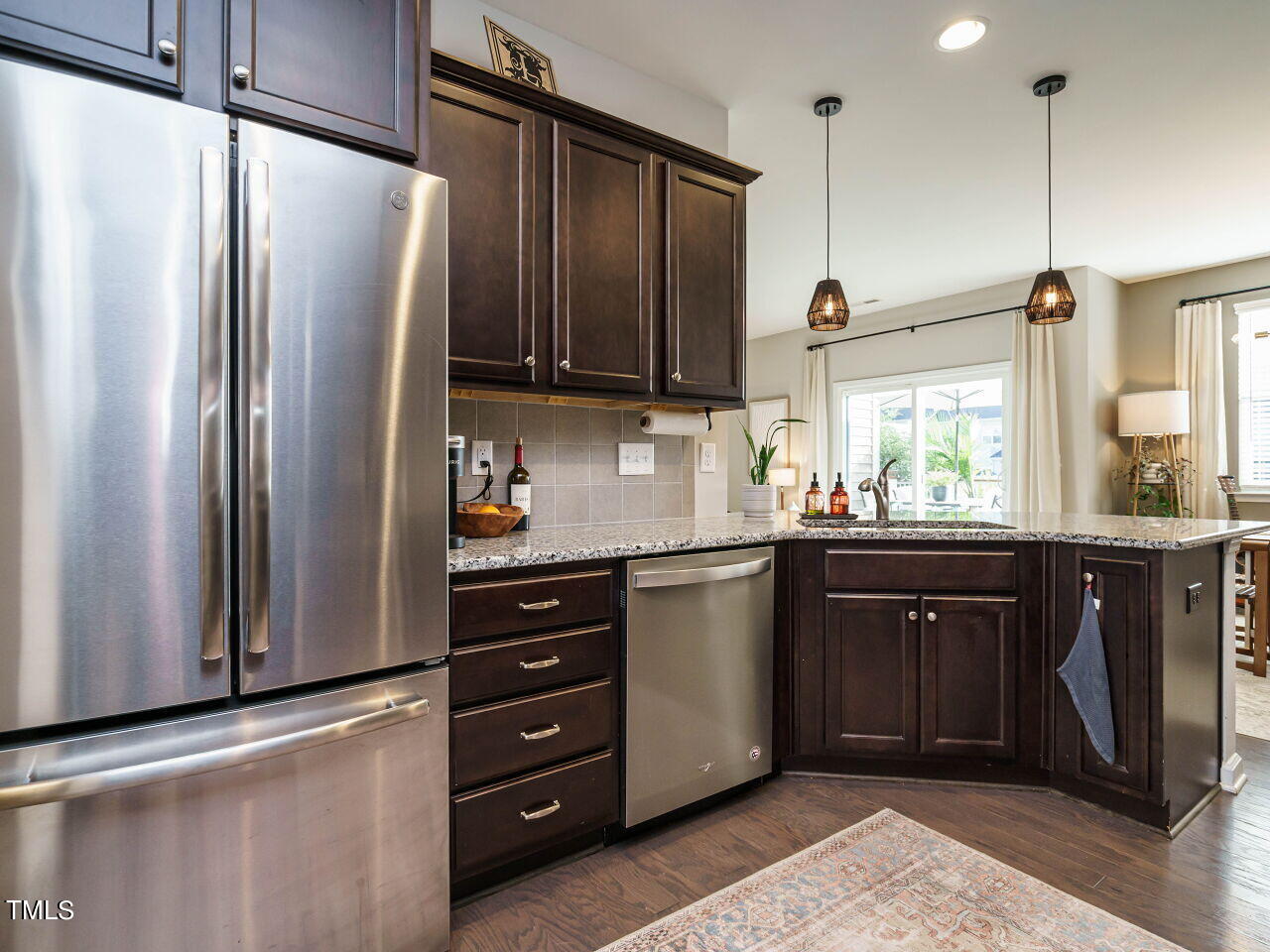 106 Zante Currant Road Durham, NC 27703 - Photo 12 of 27 a kitchen with stainless steel appliances granite countertop a refrigerator and a sink