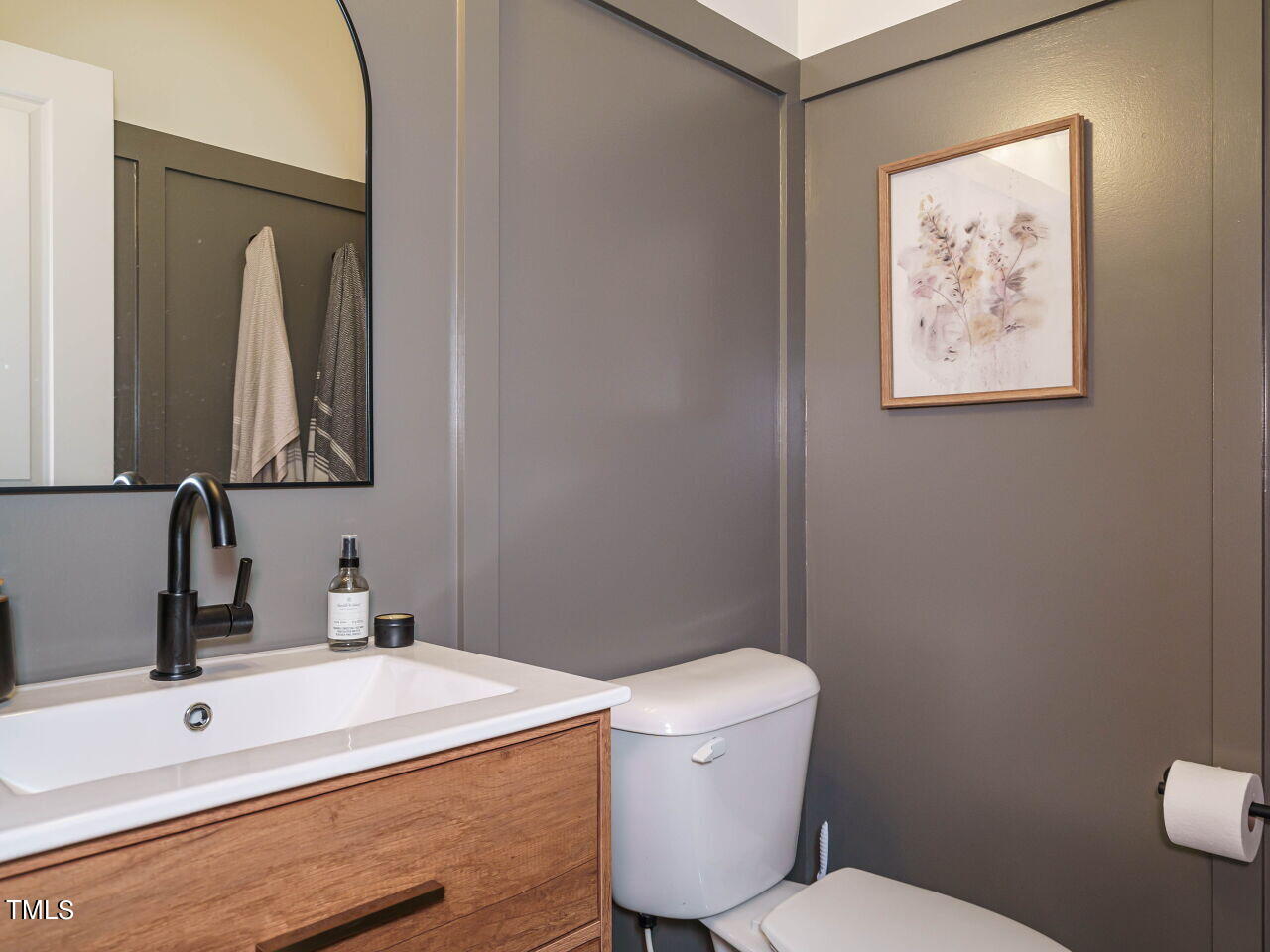 106 Zante Currant Road Durham, NC 27703 - Photo 15 of 27 a bathroom with a toilet sink and mirror