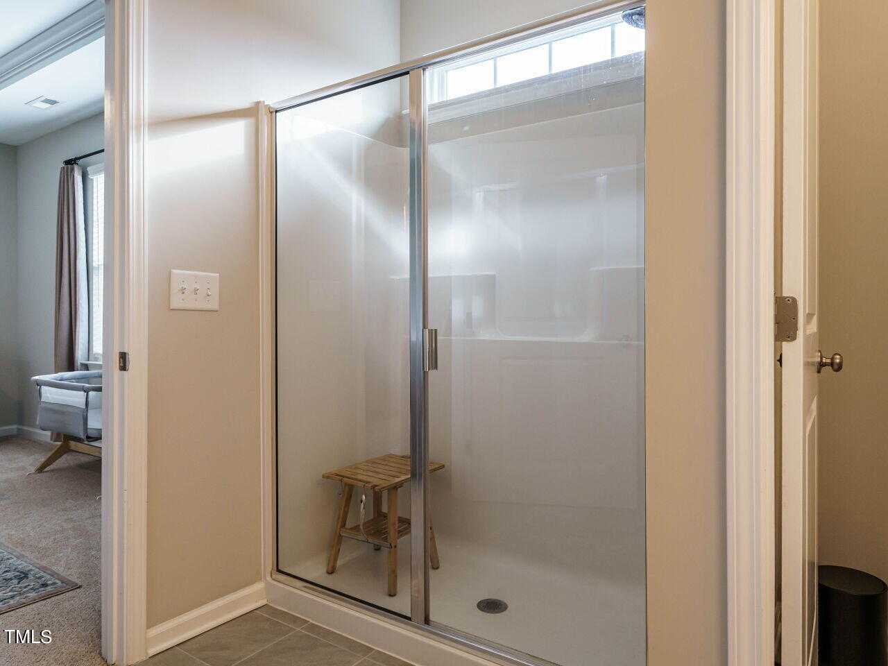 106 Zante Currant Road Durham, NC 27703 - Photo 20 of 27 a bathroom with a glass shower door