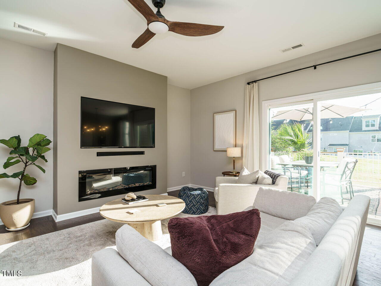 106 Zante Currant Road Durham, NC 27703 - Photo 4 of 27 a living room with furniture and a flat screen tv