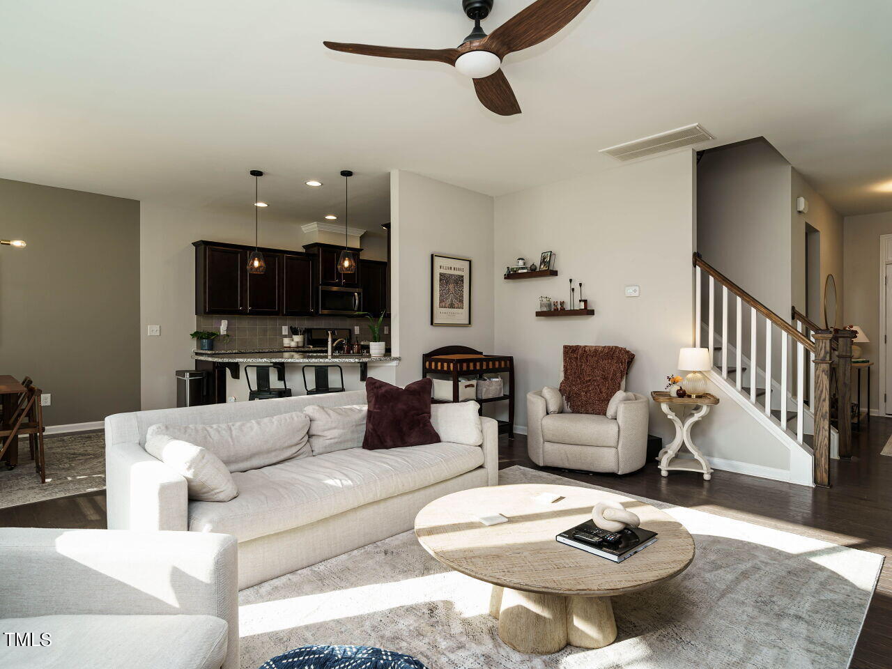 106 Zante Currant Road Durham, NC 27703 - Photo 6 of 27 a living room with furniture a dining table and a fireplace