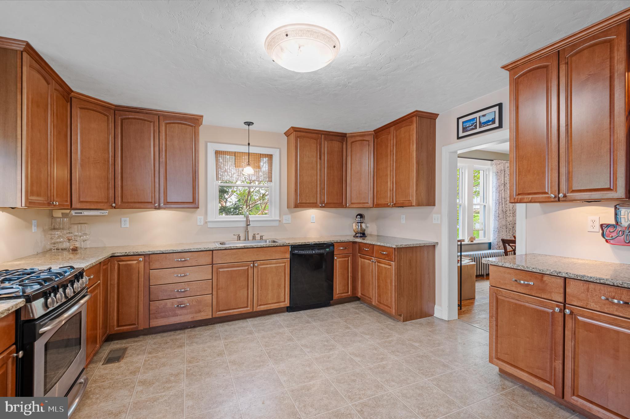 409 East Main Street Westminster, MD 21157 - Photo 16 of 46 a kitchen with sink cabinets and stainless steel appliances