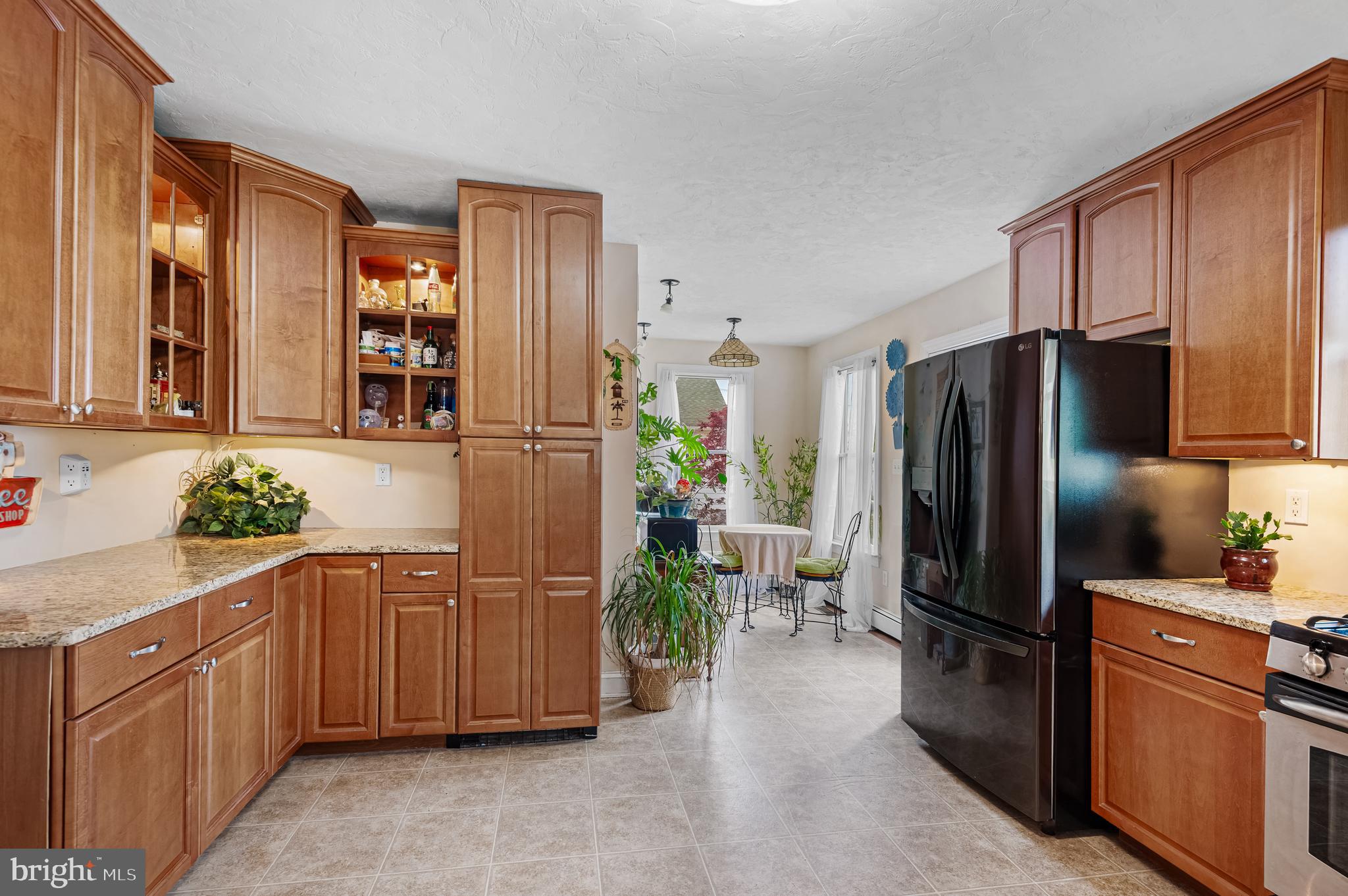 409 East Main Street Westminster, MD 21157 - Photo 18 of 46 a kitchen with stainless steel appliances a refrigerator and microwave