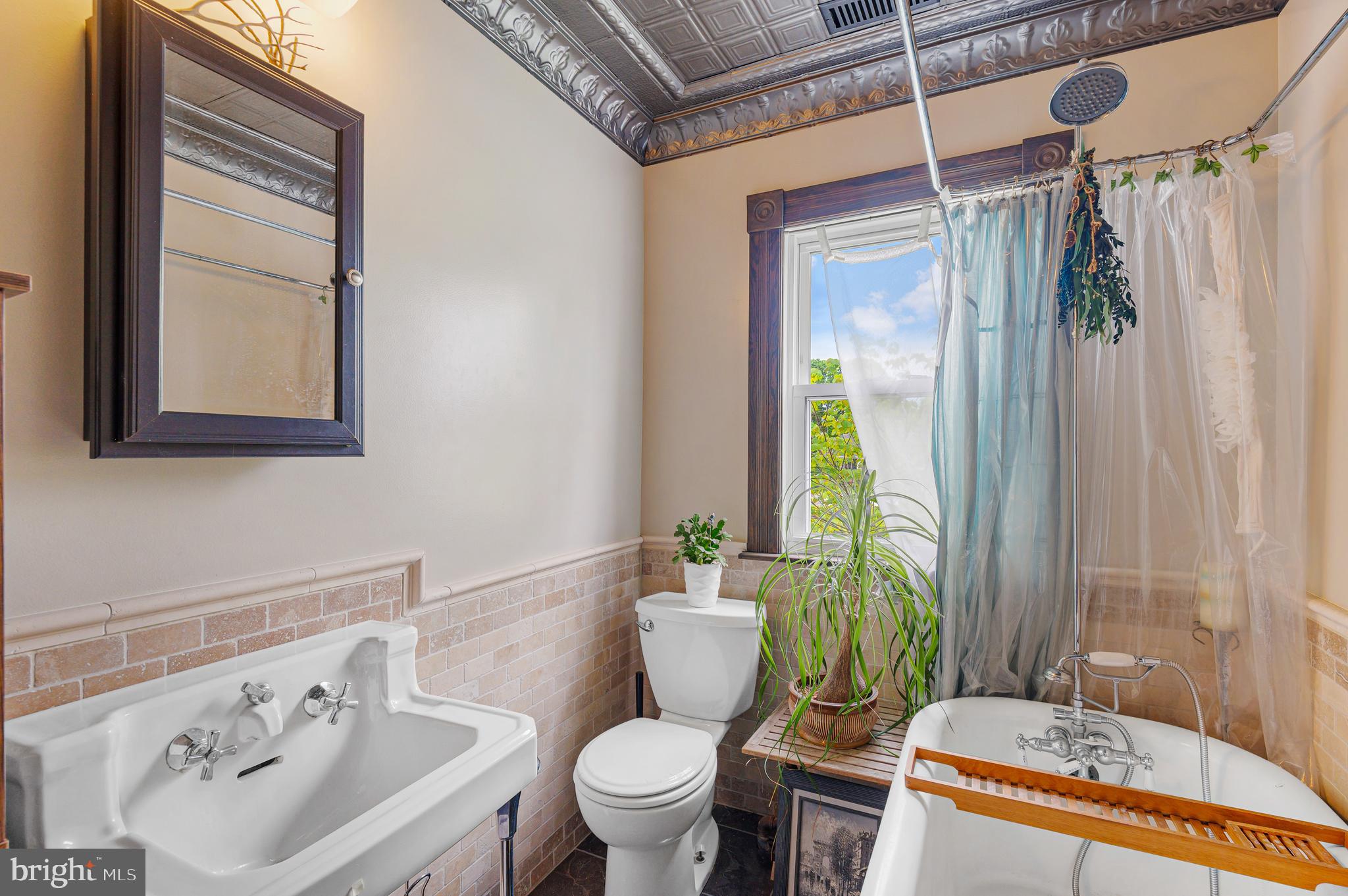 409 East Main Street Westminster, MD 21157 - Photo 24 of 46 a bathroom with a sink toilet and shower