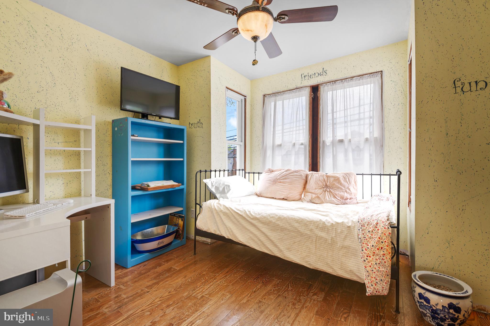 409 East Main Street Westminster, MD 21157 - Photo 26 of 46 a bedroom with a bed and a flat screen tv