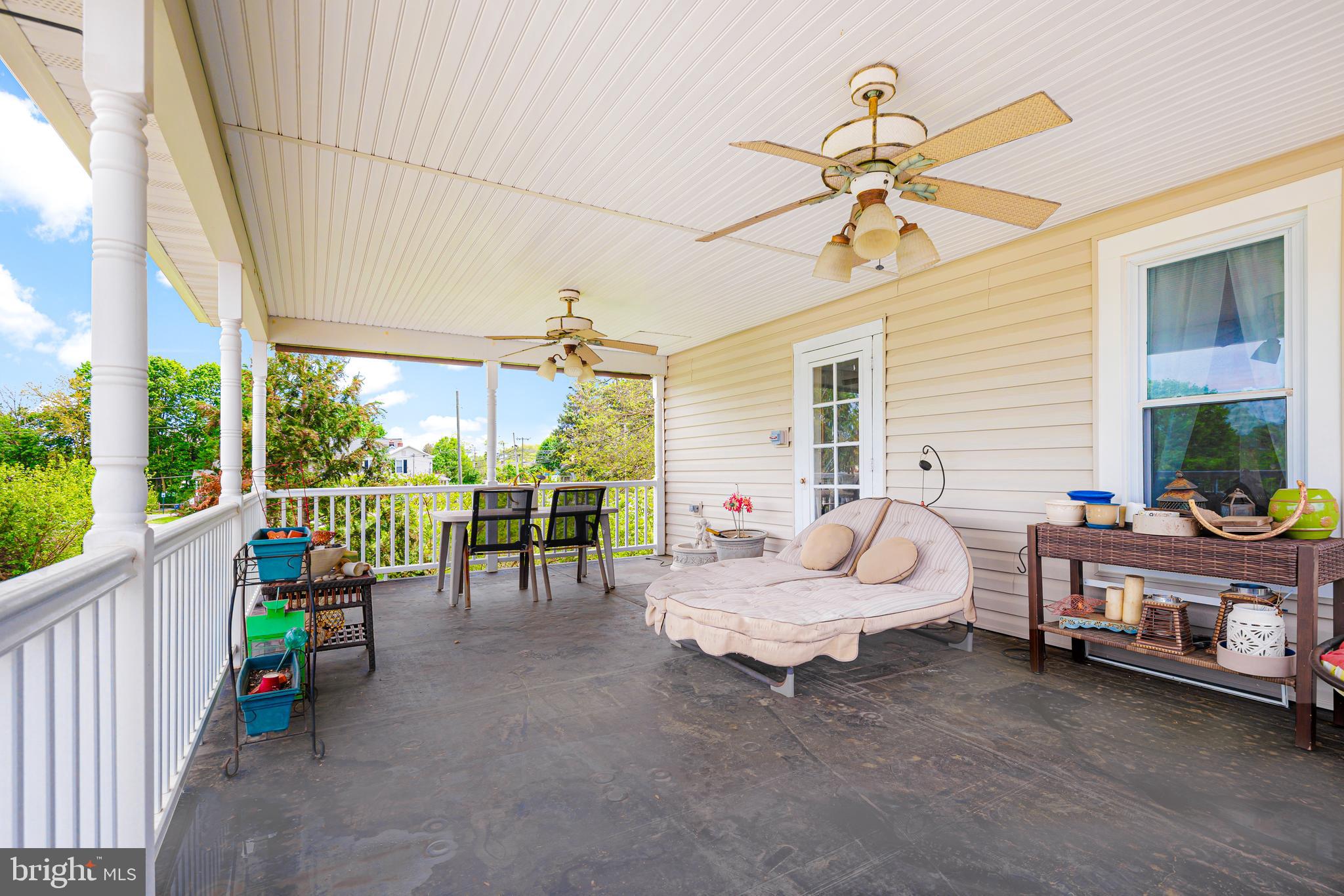 409 East Main Street Westminster, MD 21157 - Photo 30 of 46 a living room with furniture and a floor to ceiling window