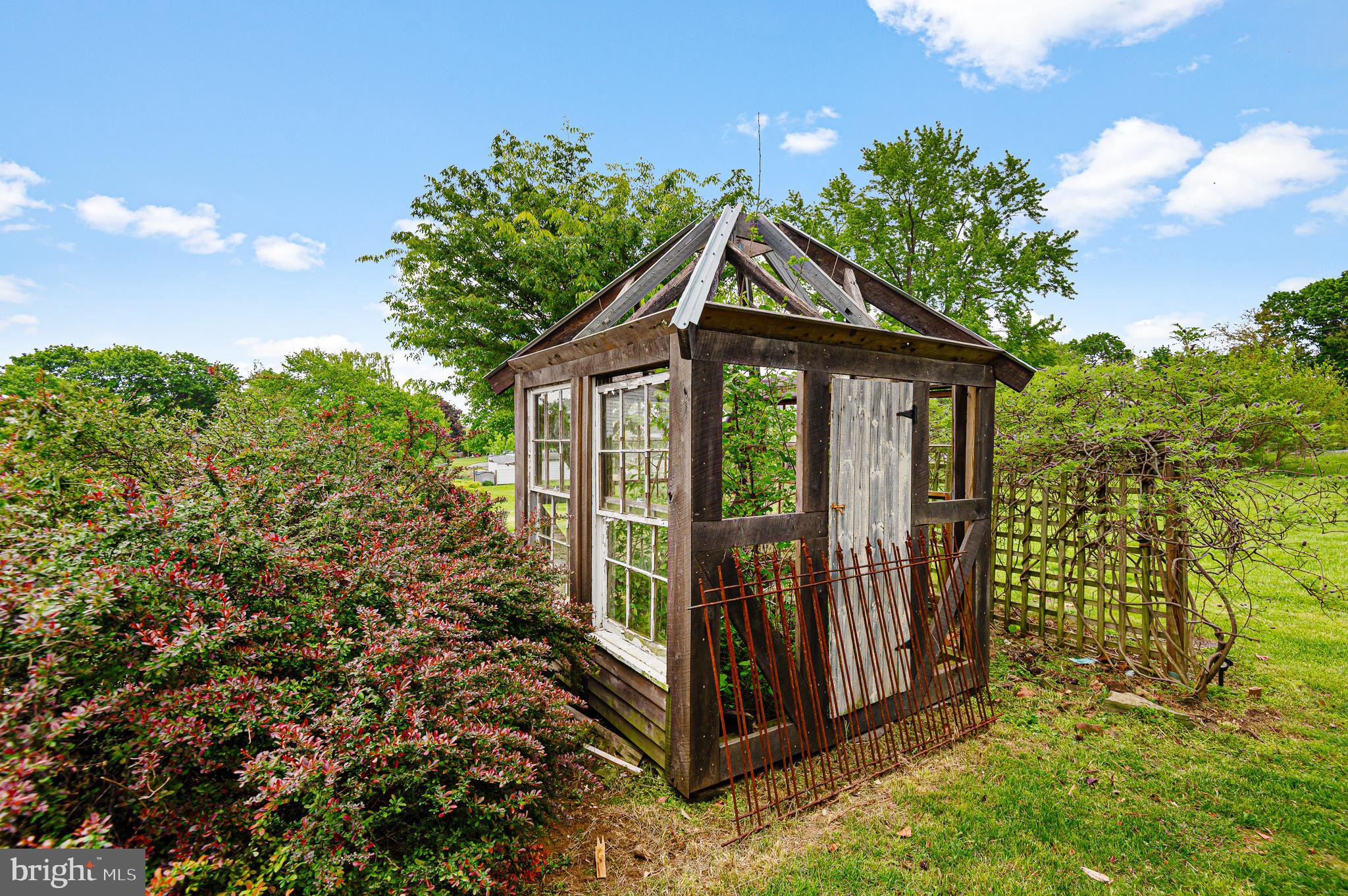 409 East Main Street Westminster, MD 21157 - Photo 36 of 46 a view of a house with a small yard and plants