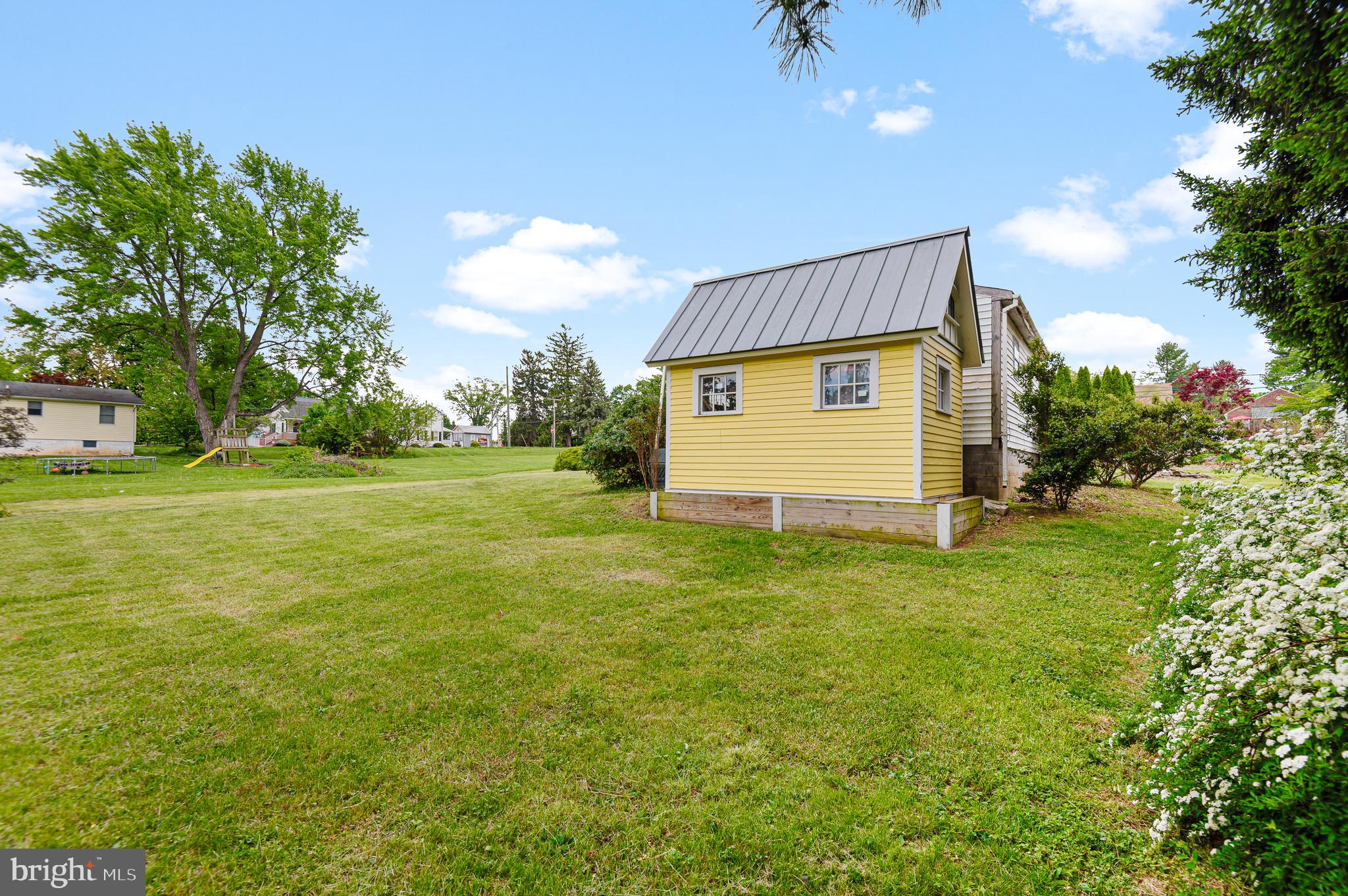 409 East Main Street Westminster, MD 21157 - Photo 38 of 46 a view of a house with a backyard