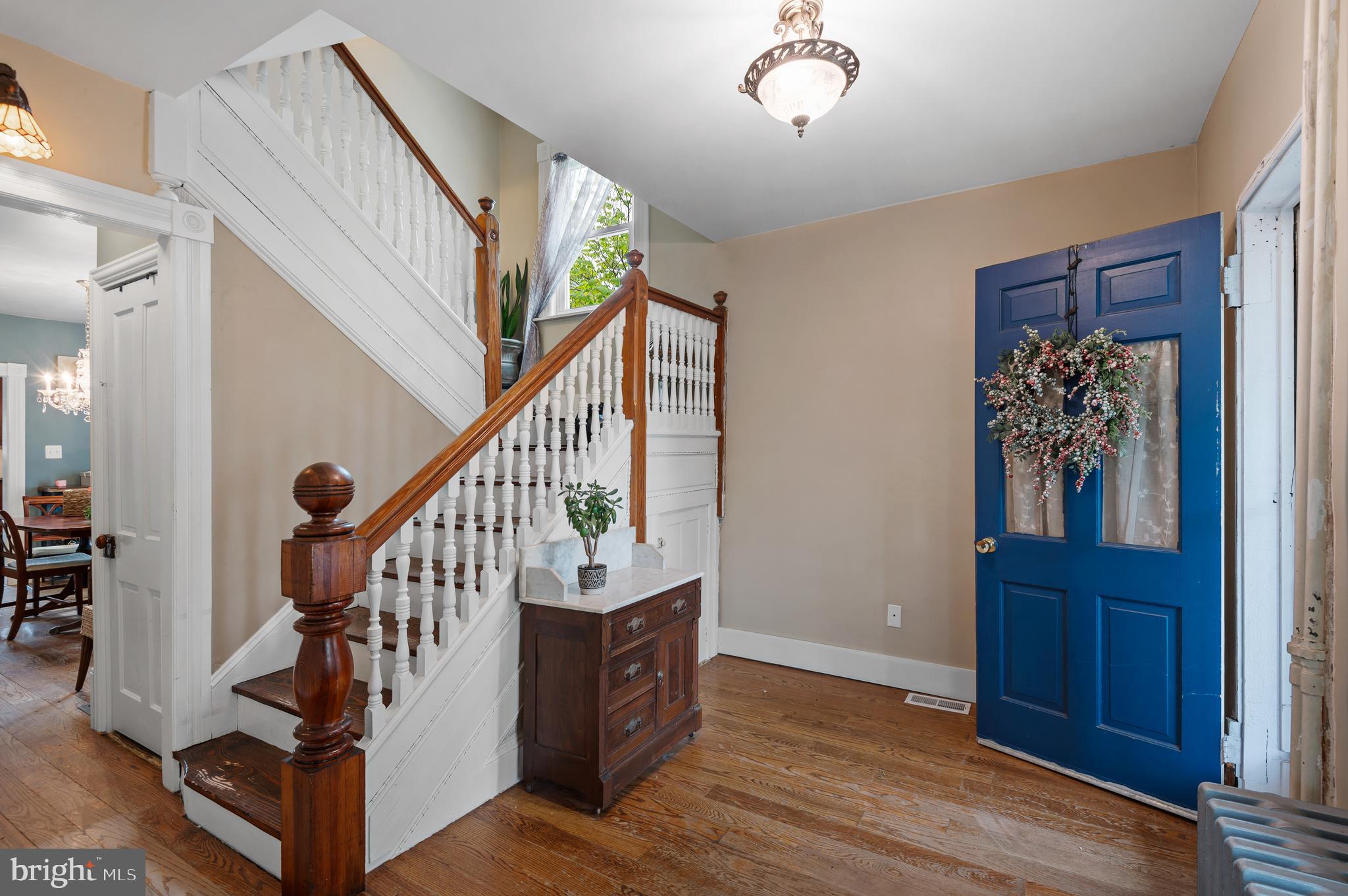 409 East Main Street Westminster, MD 21157 - Photo 4 of 46 a view of entryway with wooden floor and stairs