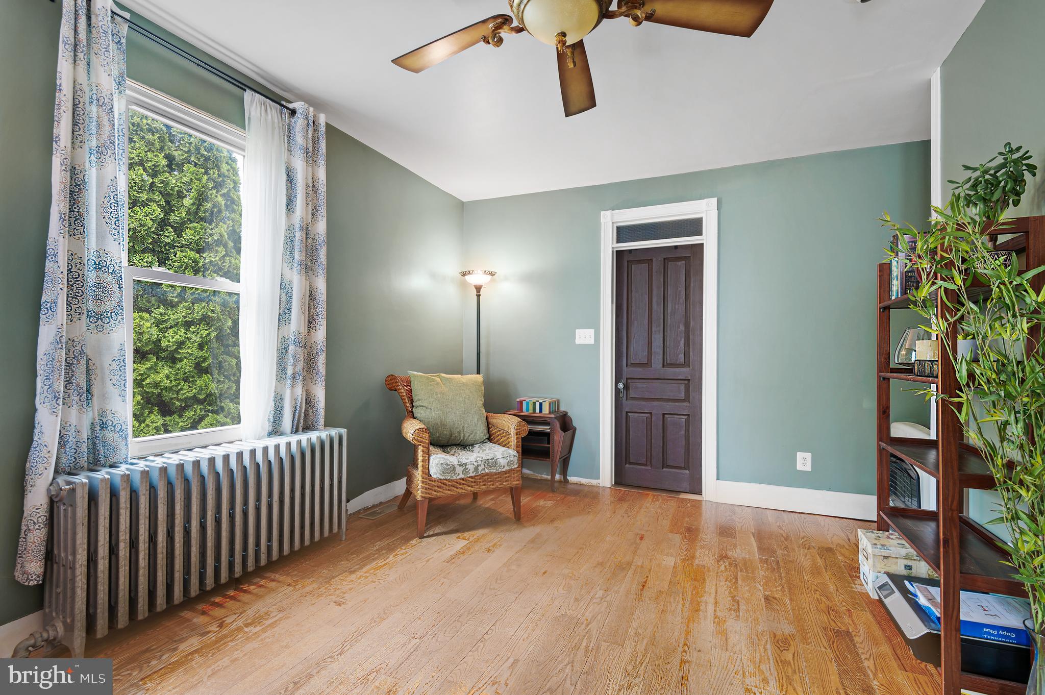 409 East Main Street Westminster, MD 21157 - Photo 7 of 46 a furnished livingroom with windows and wooden floor