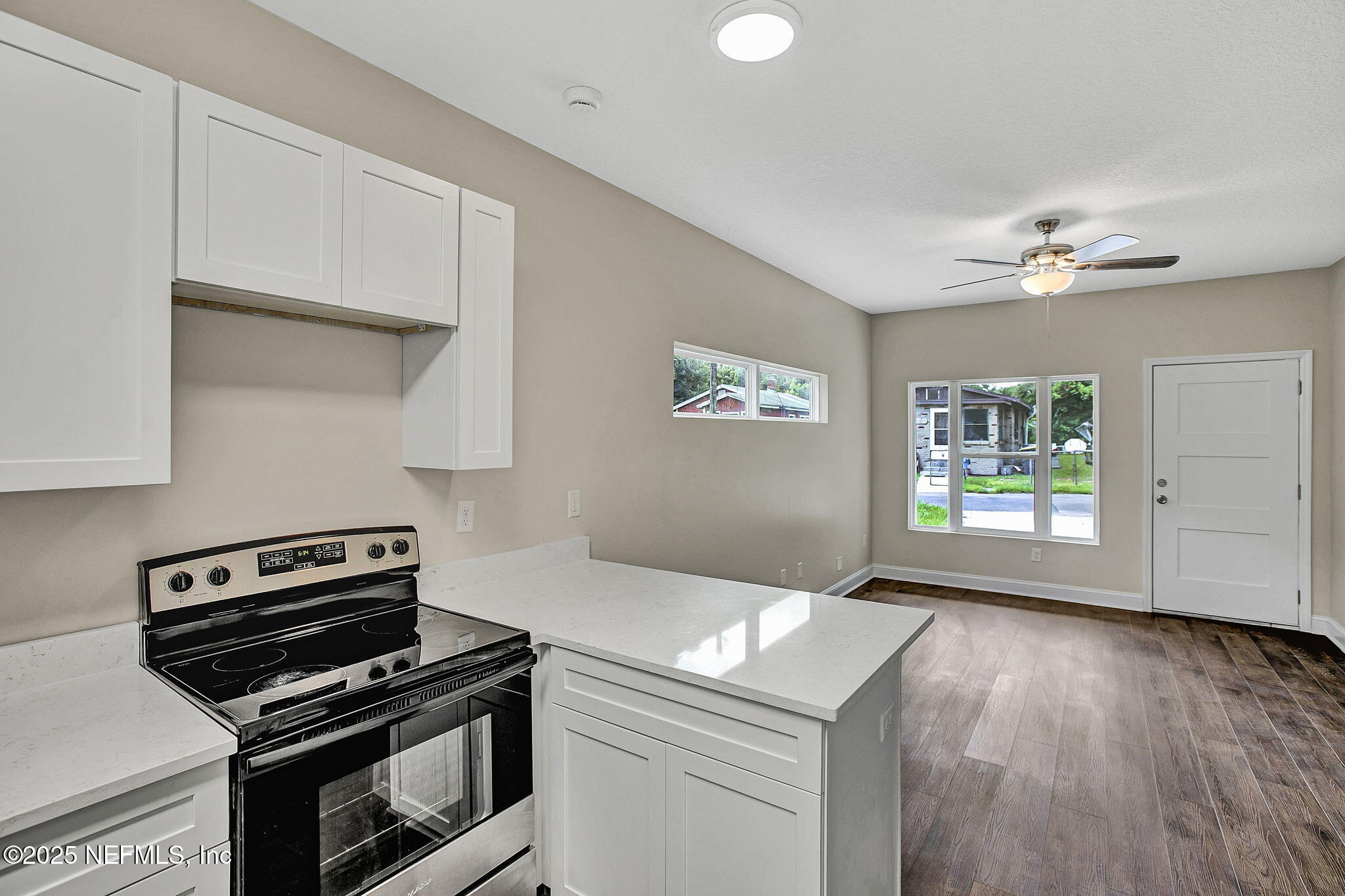 2291 Clemente Drive Jacksonville, FL 32204 - Photo 17 of 20 a kitchen with a stove and a microwave