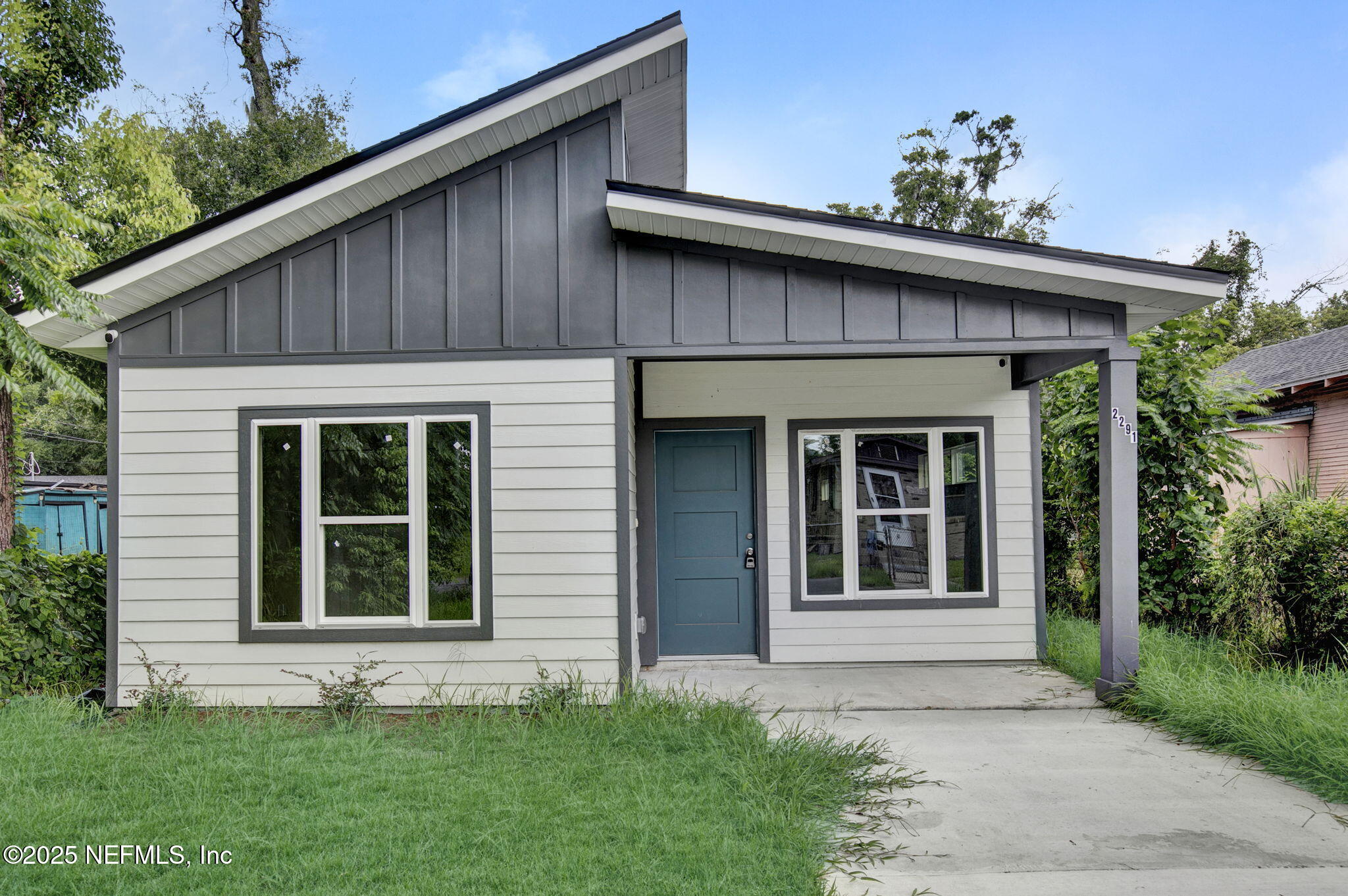 2291 Clemente Drive Jacksonville, FL 32204 - Photo 2 of 20 a front view of a house with a garden