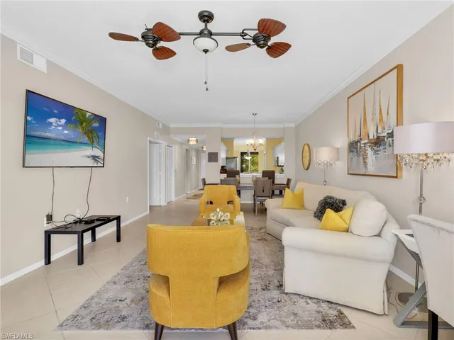 a living room with furniture and a lamp