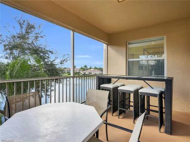 a view of a patio with a table and chairs
