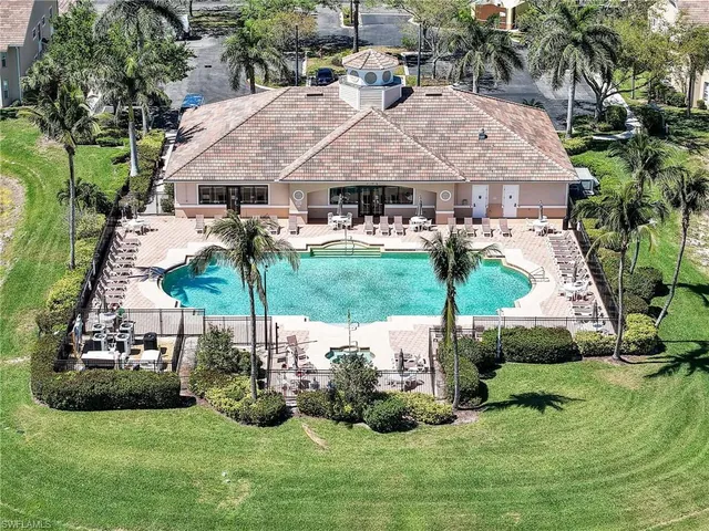 a view of a swimming pool and a yard