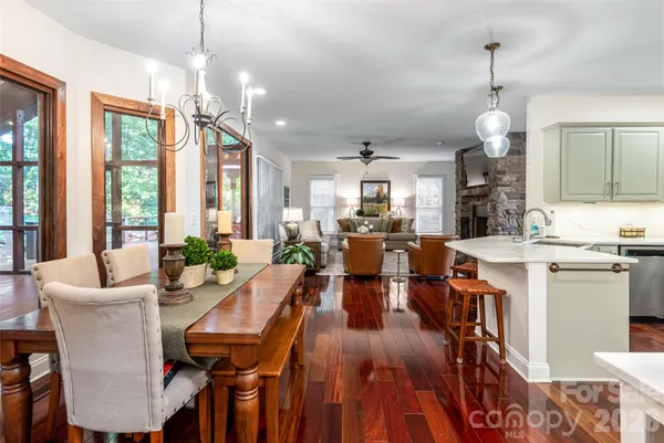 a living room with furniture a flat screen tv and a window