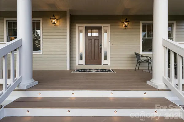 a view of a wooden deck with a bench