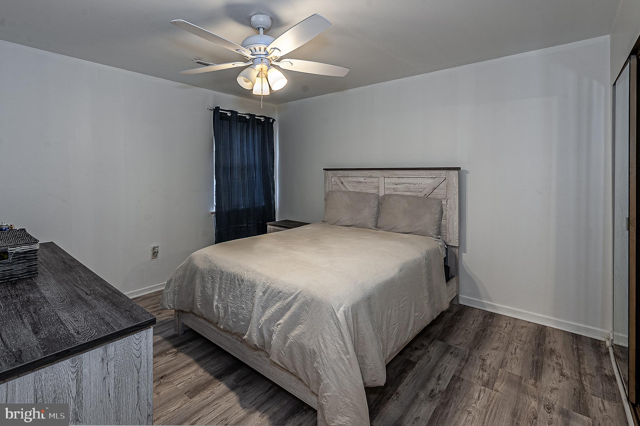 808 Winding Way Westville, NJ 08093 - Photo 11 of 14 a bedroom with a bed and a chandelier