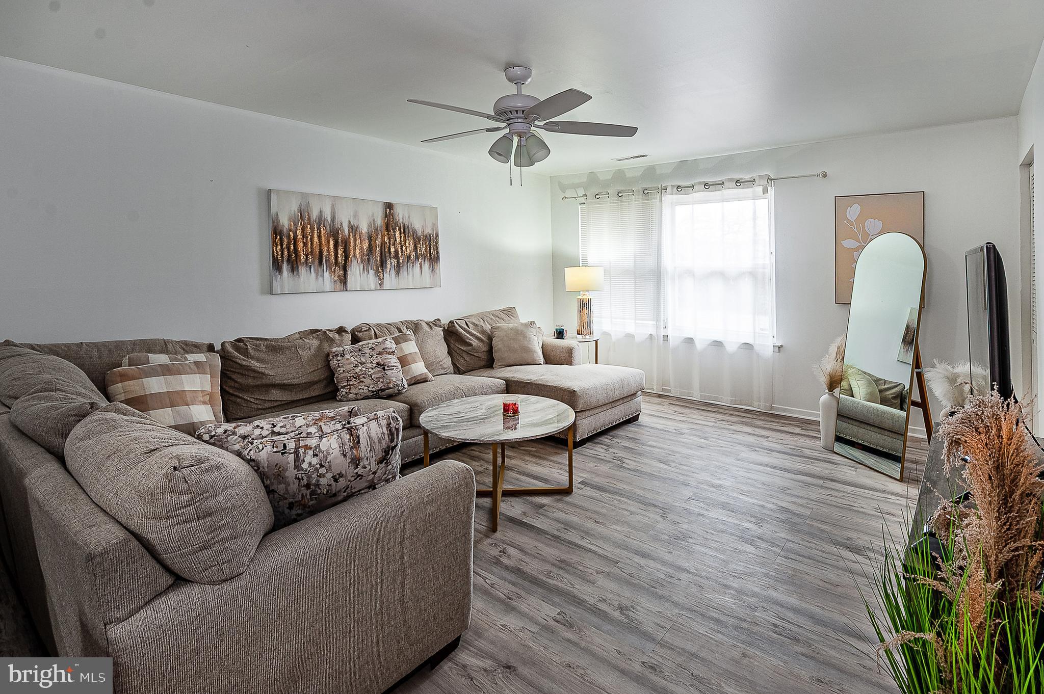 808 Winding Way Westville, NJ 08093 - Photo 4 of 14 a living room with furniture and a large window