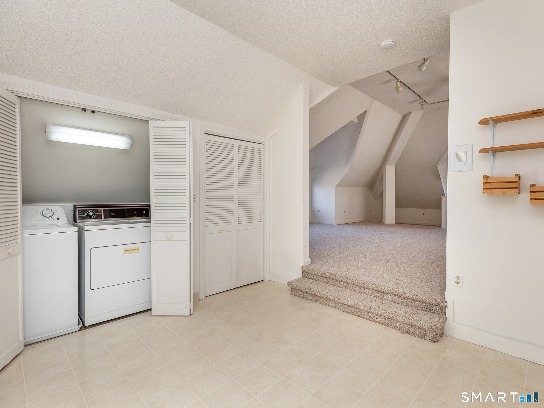 68 Wilson Avenue, Unit 105 Torrington, CT 06790 - Photo 12 of 24 a view of hallway with washer and dryer
