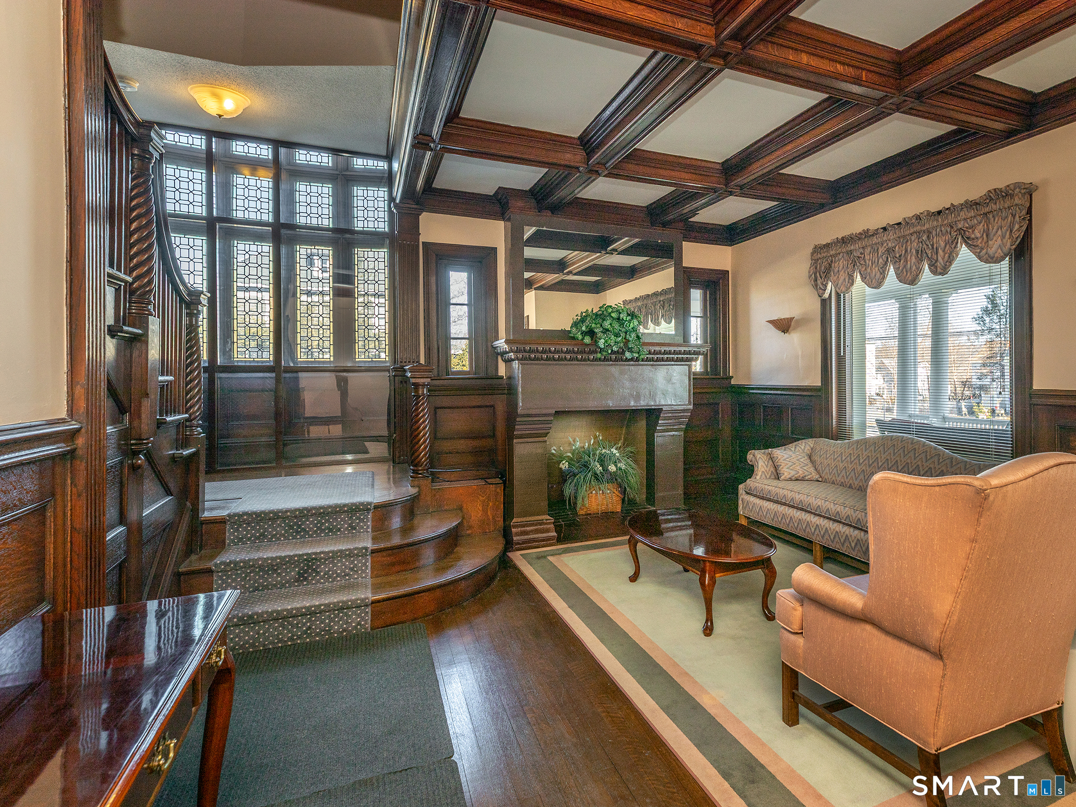 68 Wilson Avenue, Unit 105 Torrington, CT 06790 - Photo 20 of 24 a living room with furniture and a fireplace