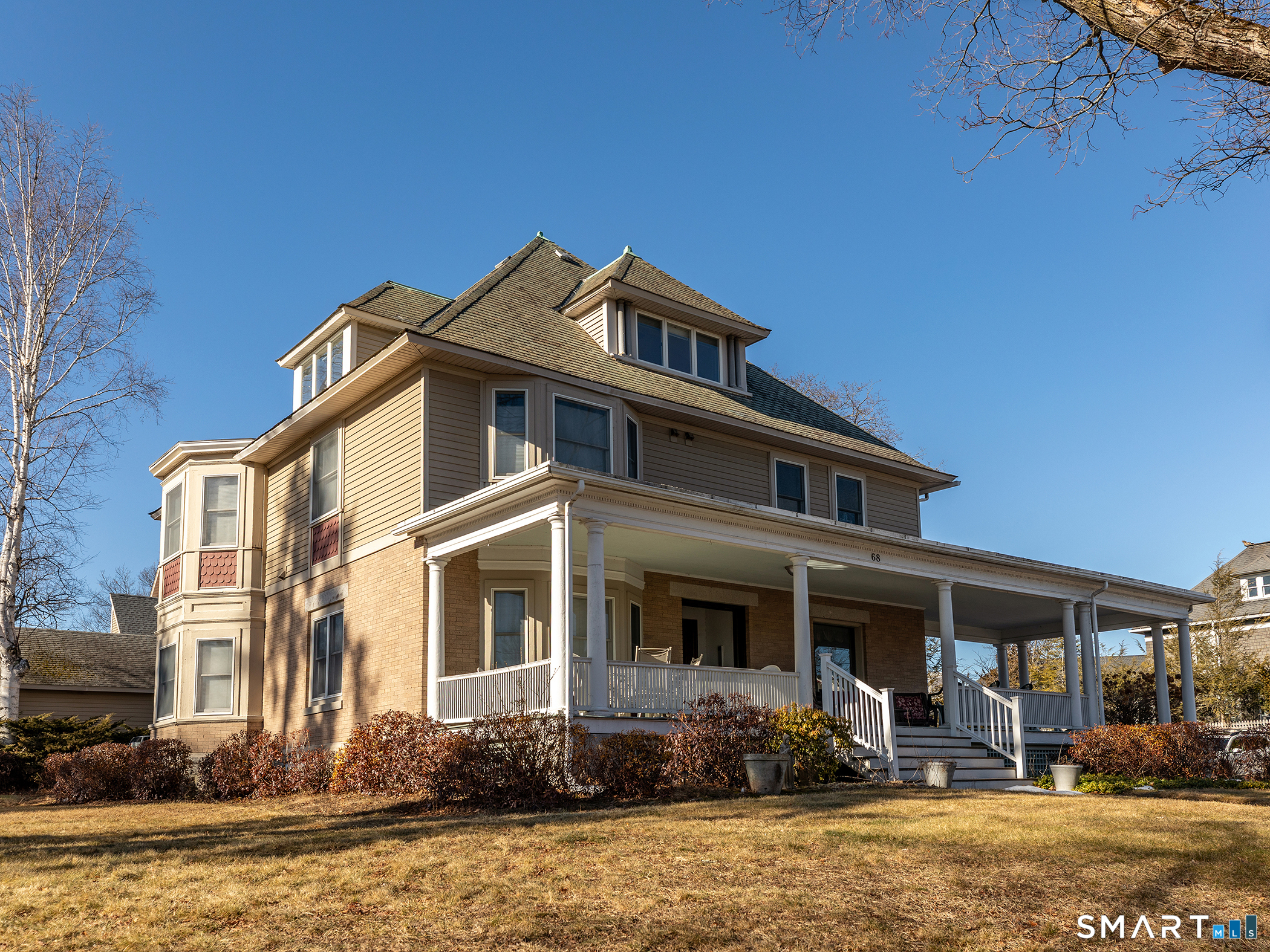 68 Wilson Avenue, Unit 105 Torrington, CT 06790 - Photo 2 of 24 a front view of a house with garden