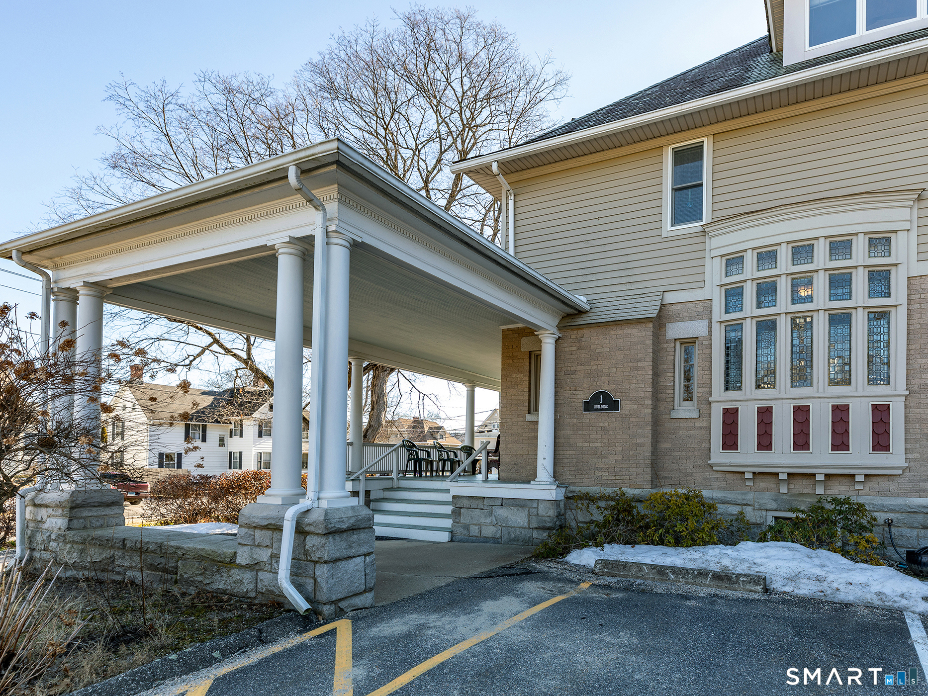 68 Wilson Avenue, Unit 105 Torrington, CT 06790 - Photo 3 of 24 a view of a house with a yard