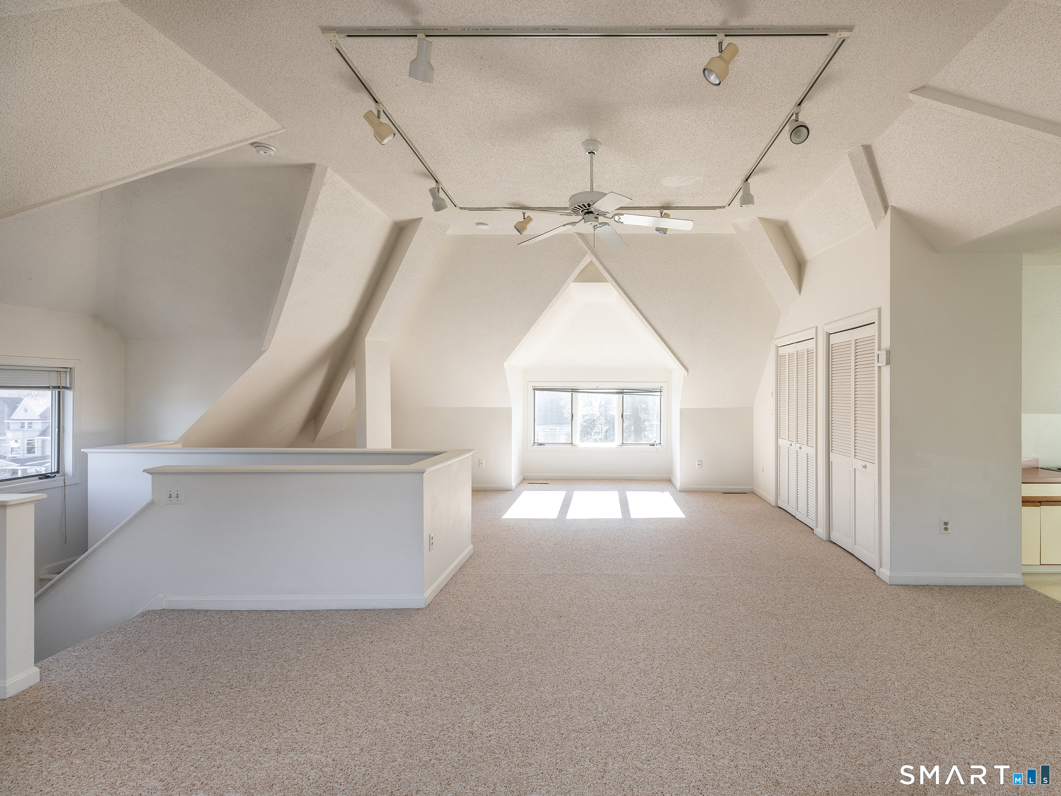 68 Wilson Avenue, Unit 105 Torrington, CT 06790 - Photo 5 of 24 a view of hallway with windows and a chandelier