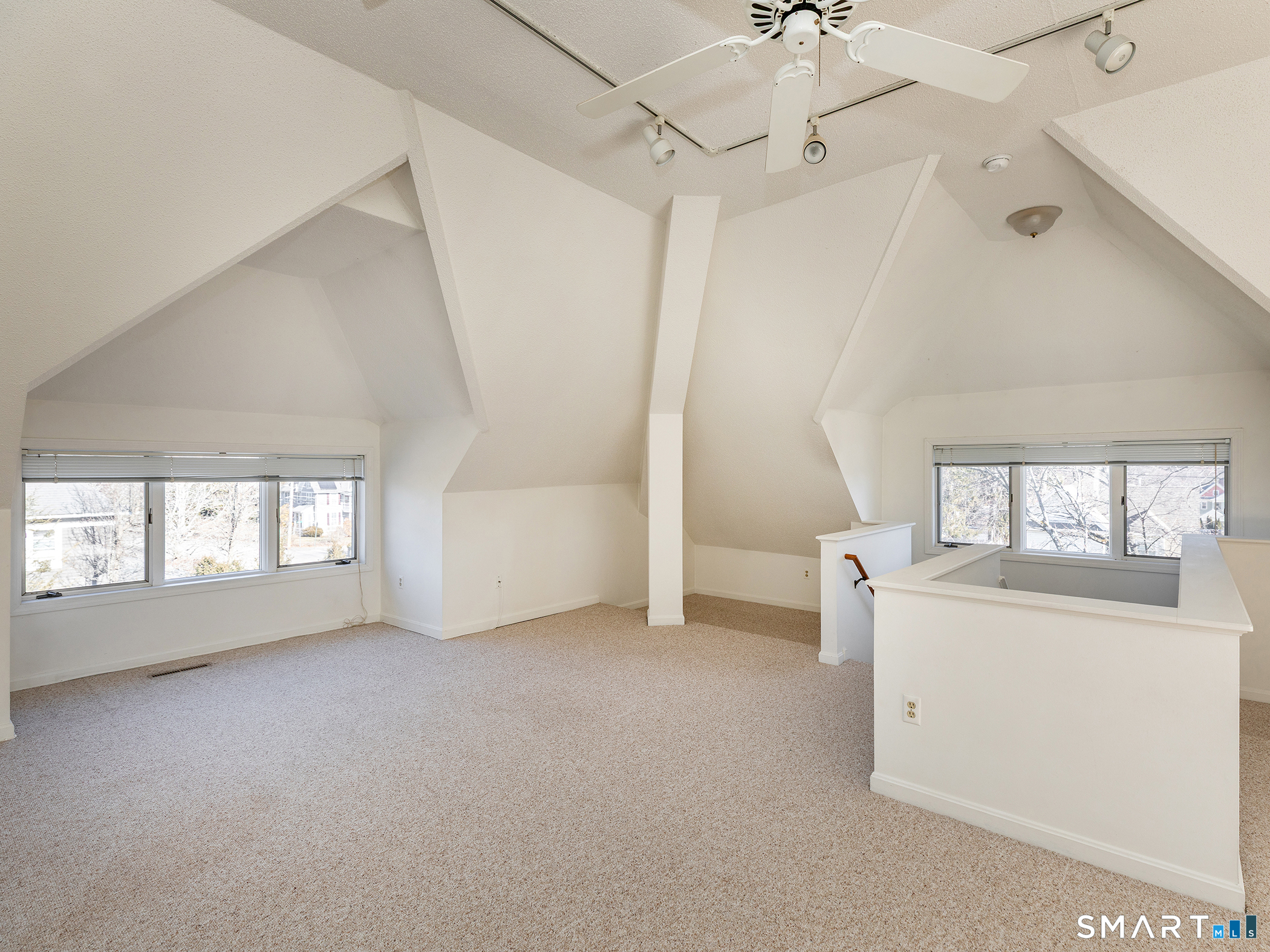 68 Wilson Avenue, Unit 105 Torrington, CT 06790 - Photo 8 of 24 an empty room with windows and cabinet