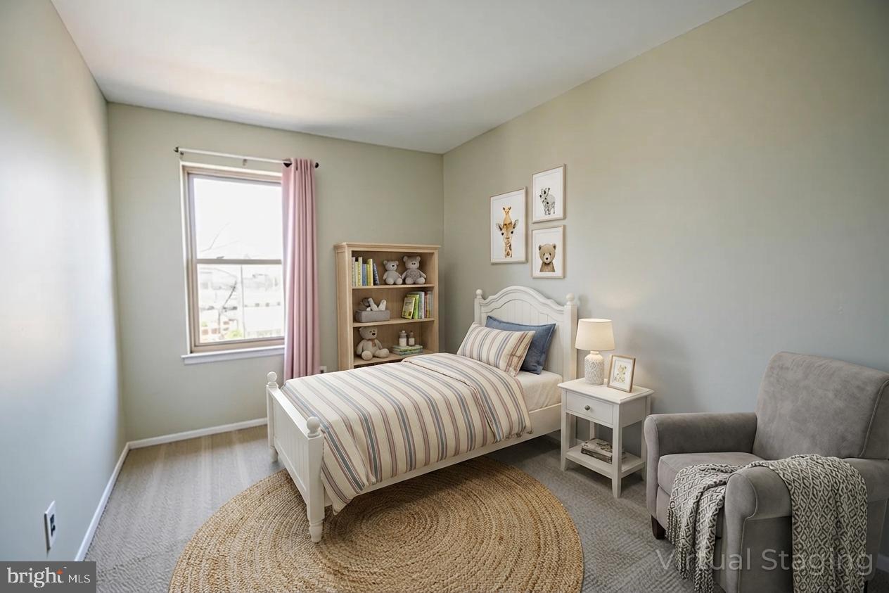 617 St Anthony Lane Upper Darby, PA 19082 - Photo 15 of 26 a bedroom with a bed and a couch