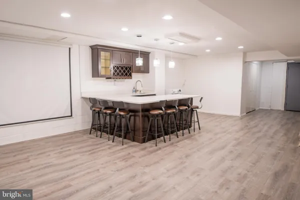 a kitchen with stainless steel appliances a kitchen island a stove and a refrigerator