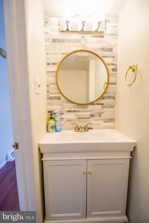 a bathroom with a sink and mirror