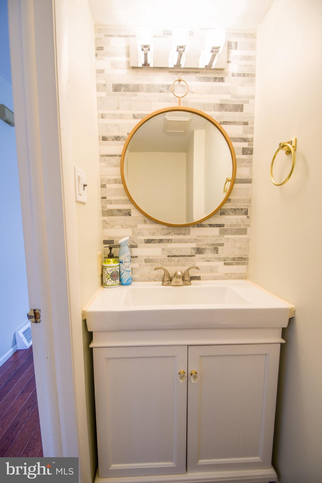617 St Anthony Lane Upper Darby, PA 19082 - Photo 26 of 26 a bathroom with a sink and mirror
