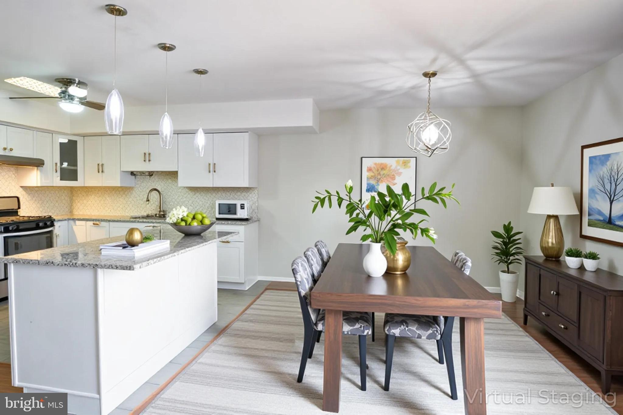 617 St Anthony Lane Upper Darby, PA 19082 - Photo 7 of 26 a kitchen with a table and chairs in it