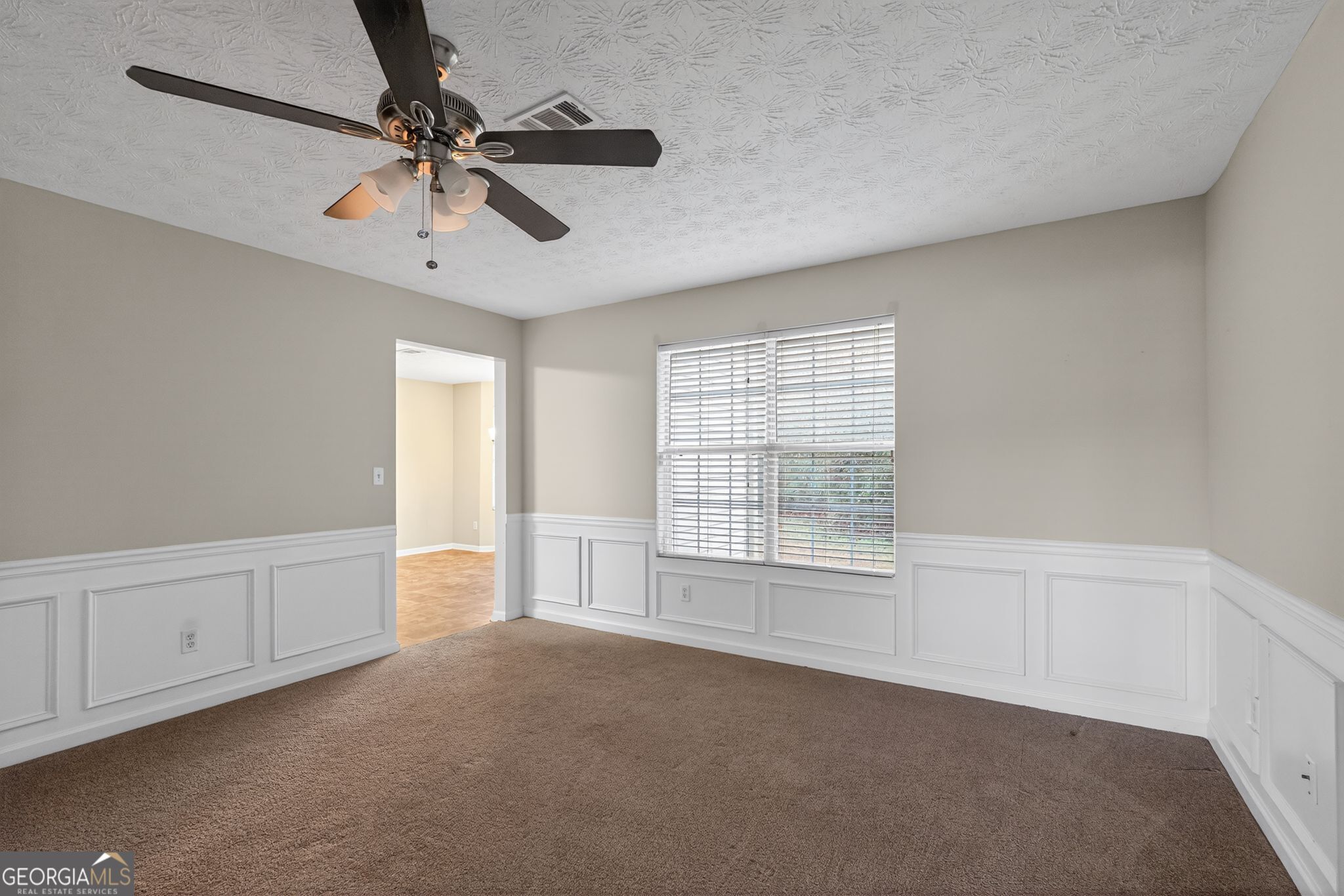 6463 Castle Ct Way Lithonia, GA 30058 - Photo 13 of 35 a view of an empty room with a window