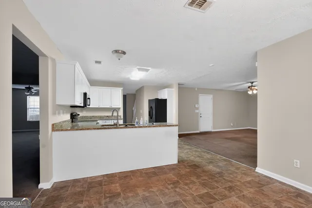 a view of a kitchen with a sink