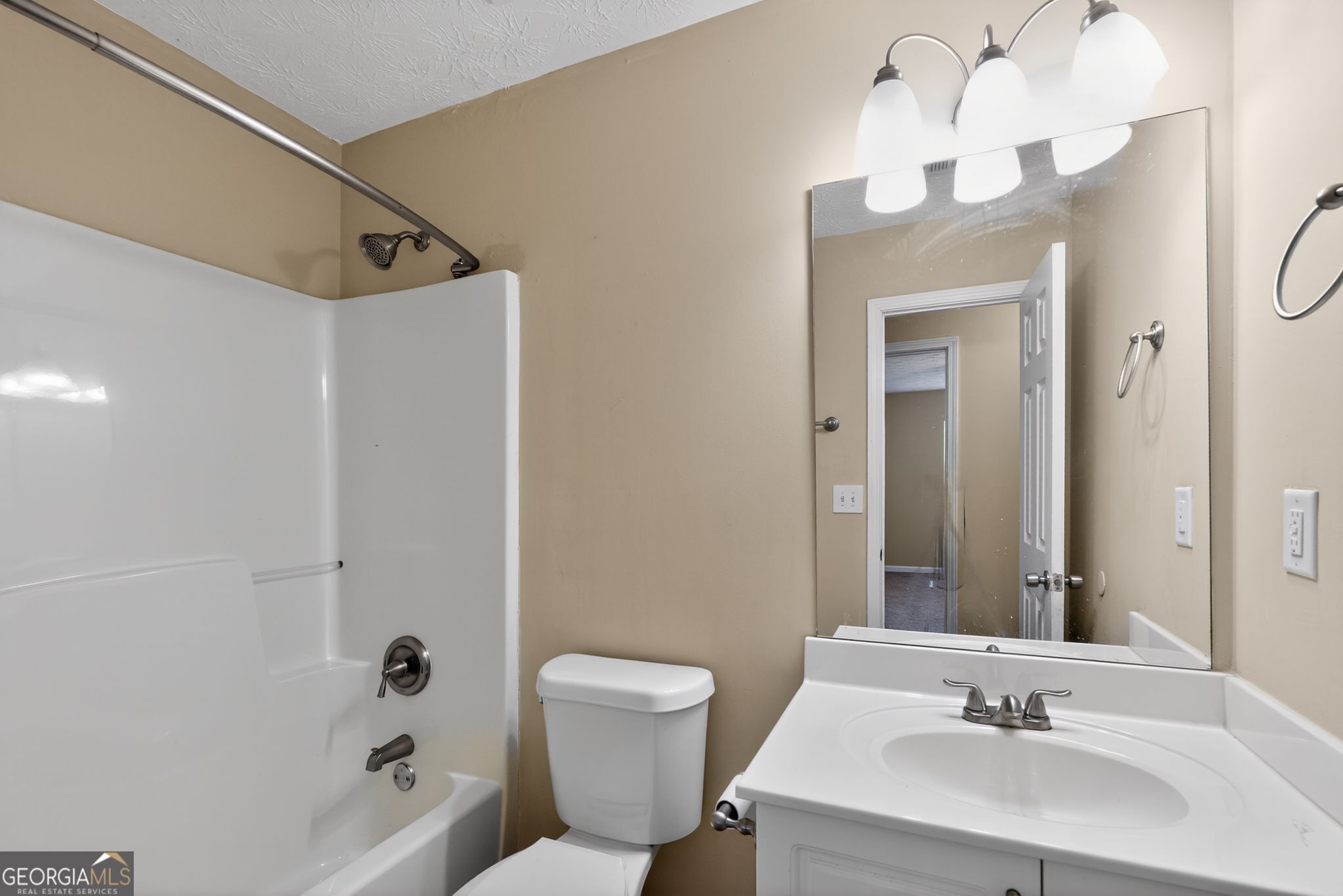 6463 Castle Ct Way Lithonia, GA 30058 - Photo 23 of 35 a bathroom with a sink a toilet and shower