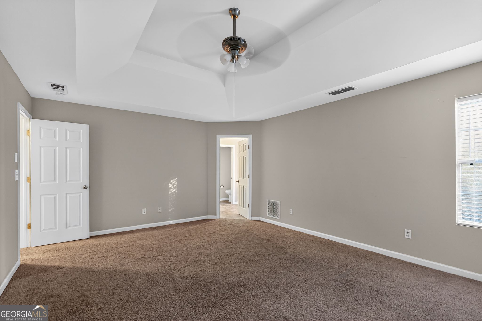 6463 Castle Ct Way Lithonia, GA 30058 - Photo 4 of 35 a view of an empty room with a window