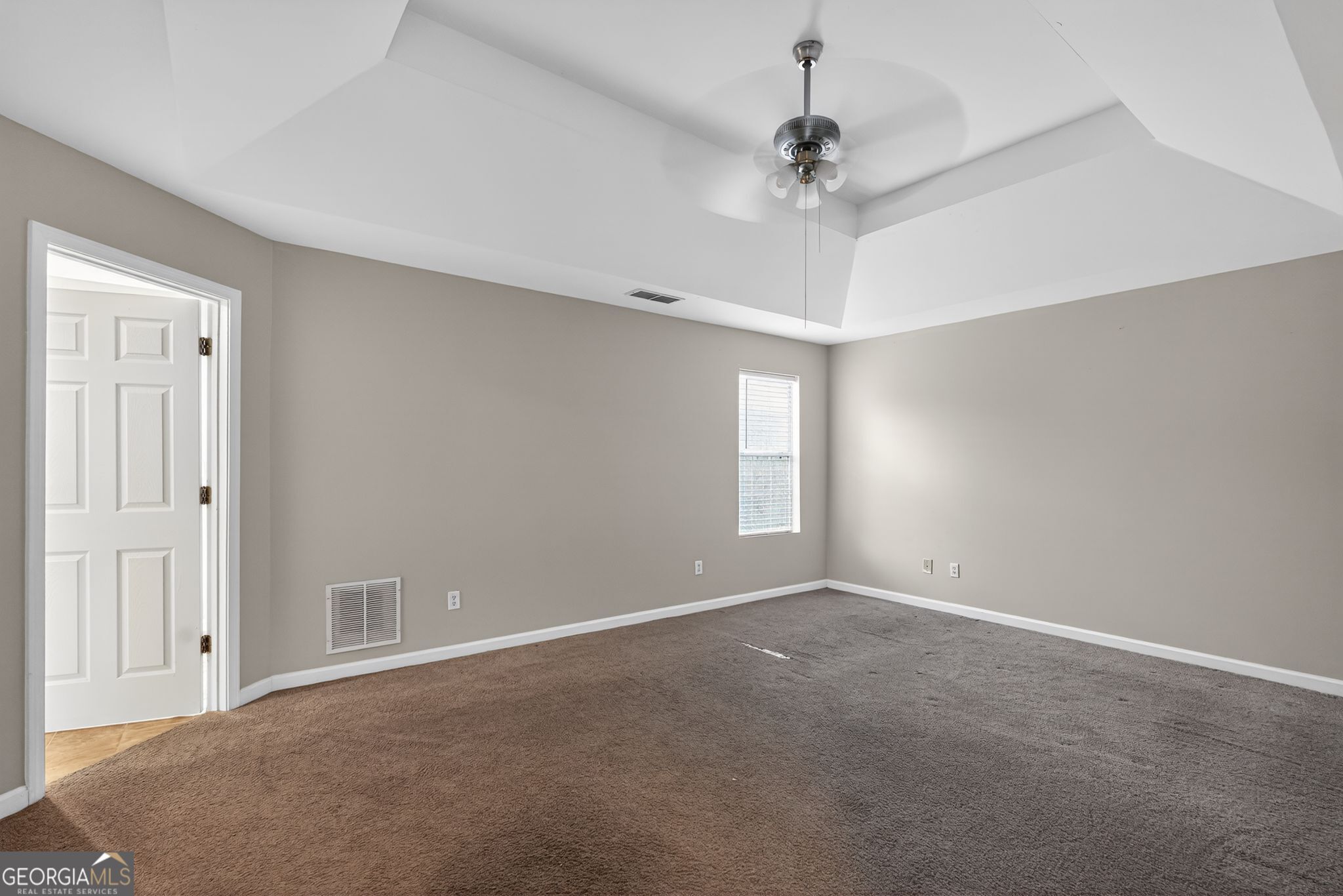 6463 Castle Ct Way Lithonia, GA 30058 - Photo 7 of 35 a view of an empty room with a window
