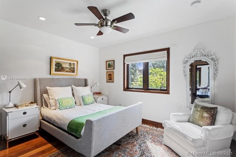 1047 Mariner Drive Key Biscayne, FL 33149 - Photo 14 of 15 a bedroom with a large bed and a couch