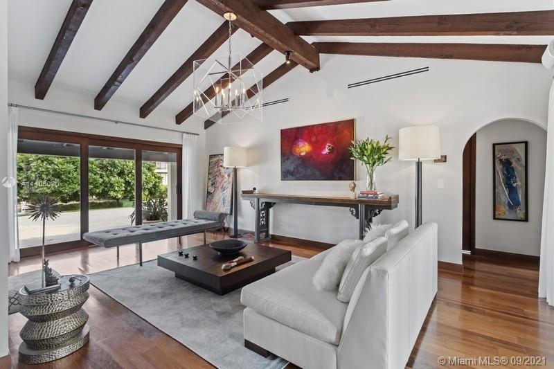 1047 Mariner Drive Key Biscayne, FL 33149 - Photo 6 of 15 a living room with furniture and a flat screen tv