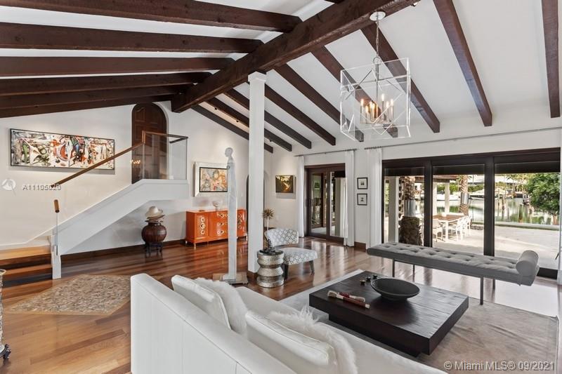 1047 Mariner Drive Key Biscayne, FL 33149 - Photo 7 of 15 a living room with furniture and a floor to ceiling window
