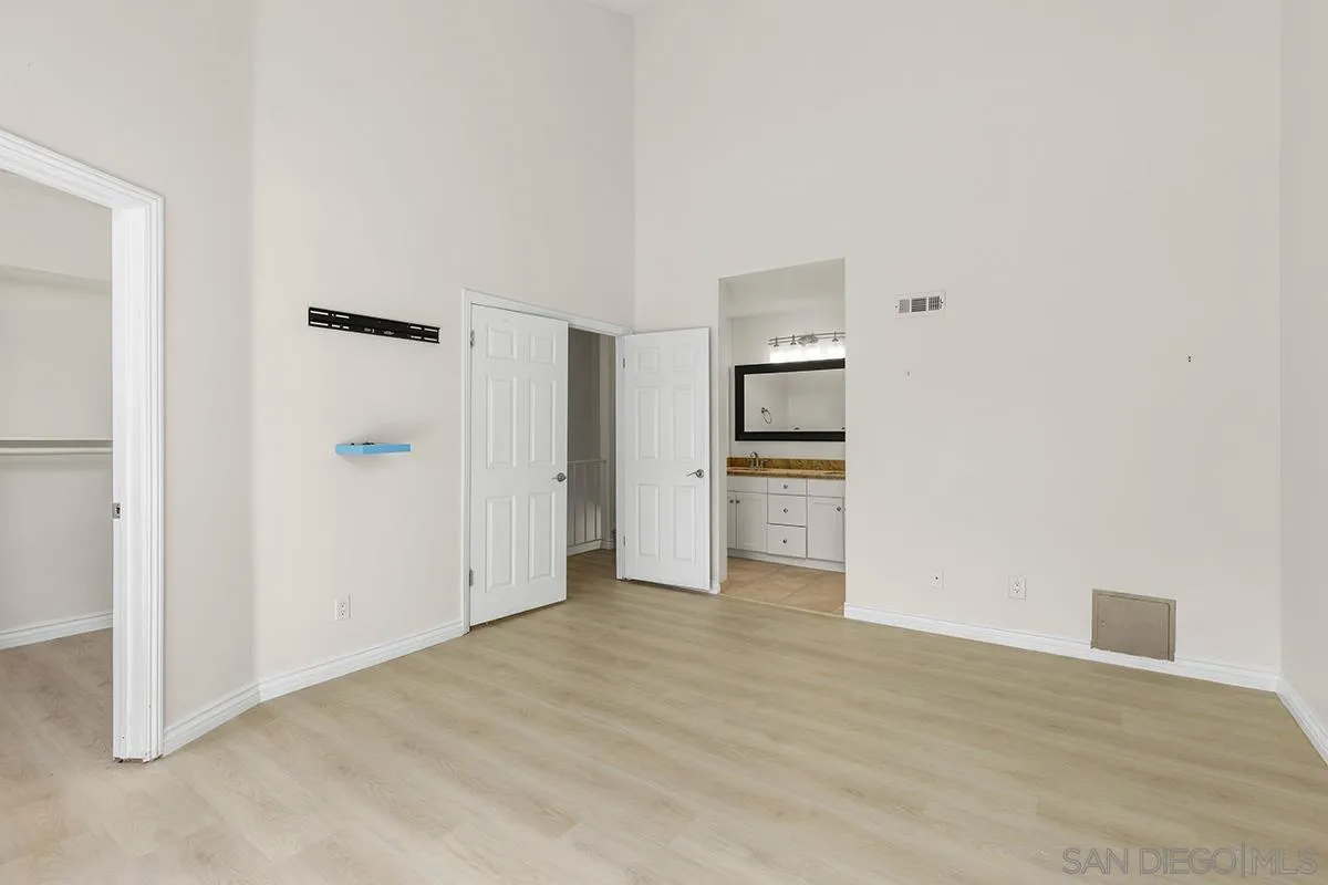 4028 Mahaila Avenue, Unit C San Diego, CA 92122 - Photo 20 of 34 a view of empty room with wooden floor