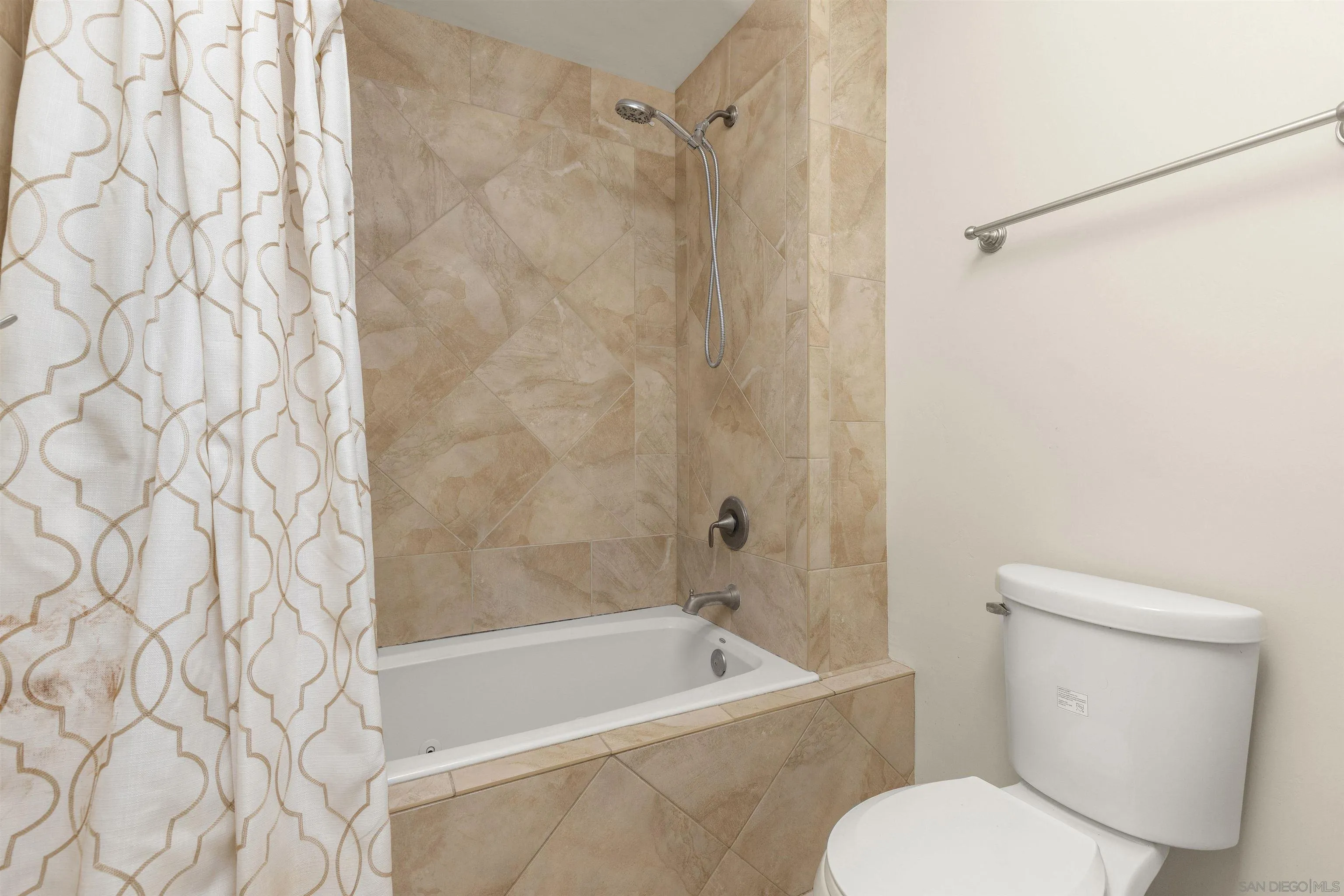 4028 Mahaila Avenue, Unit C San Diego, CA 92122 - Photo 28 of 34 a bathroom with a toilet and a bathtub